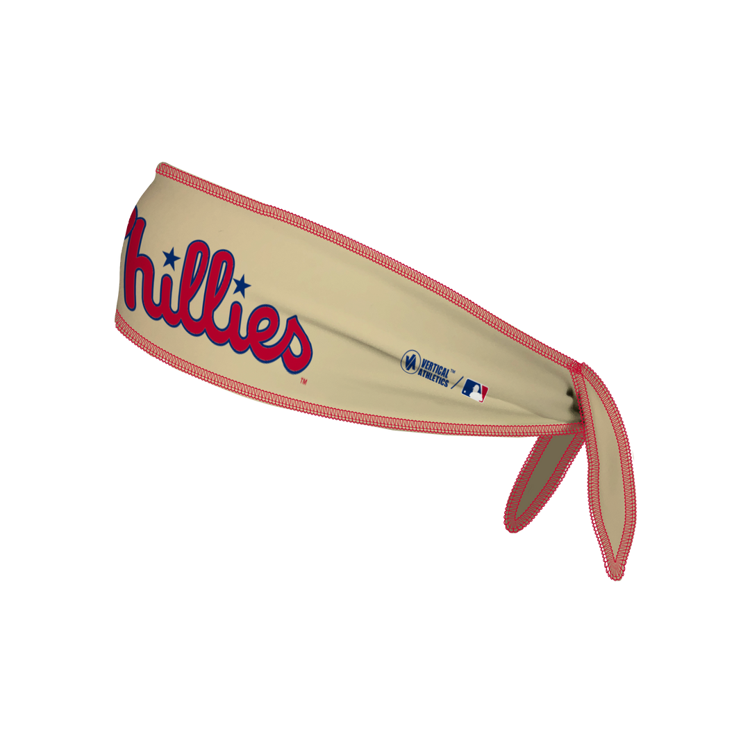 Side view of MLB Philadelphia Philies cream Tie-Back Cooling Headband with Alt Wordmark Logo . Made in USA, Vertical  Athletics brand.   